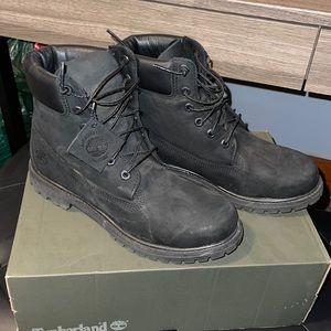 Black Timberland boots.